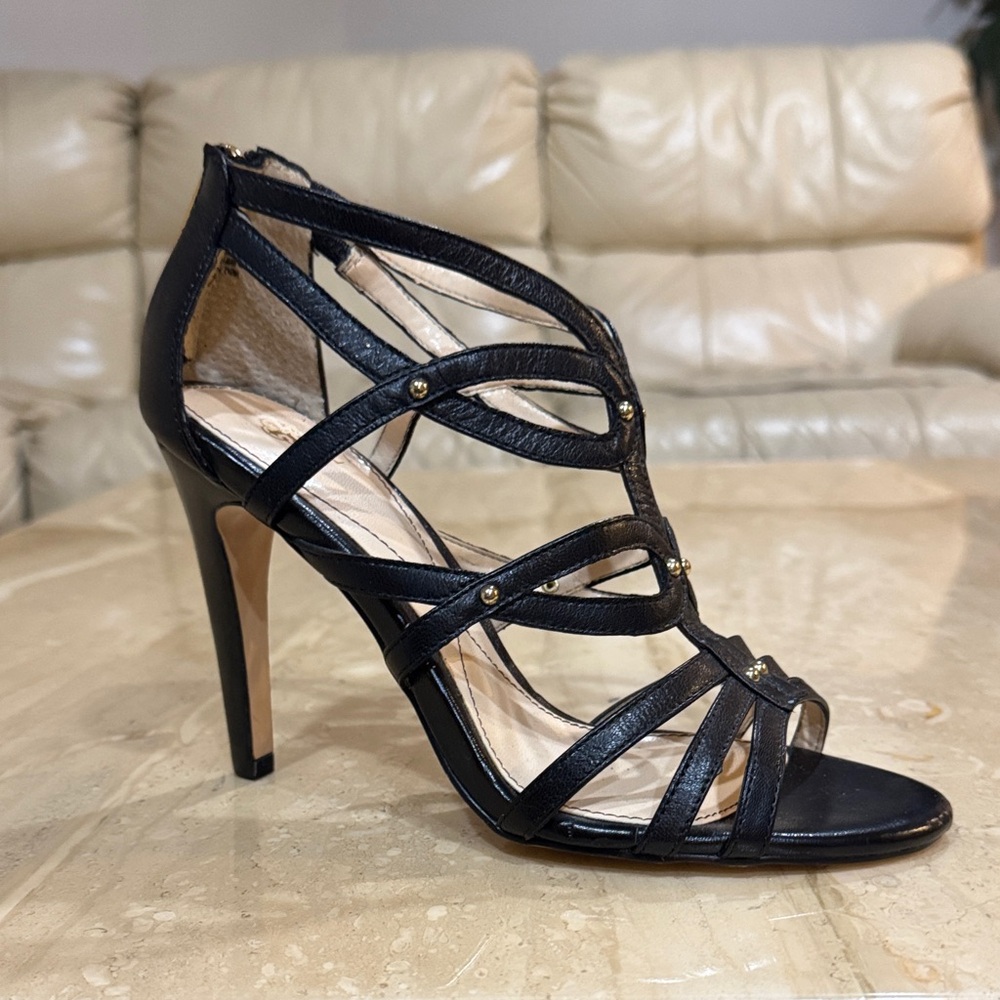 Isola Black Strappy High Heel Sandal with Gold Accents